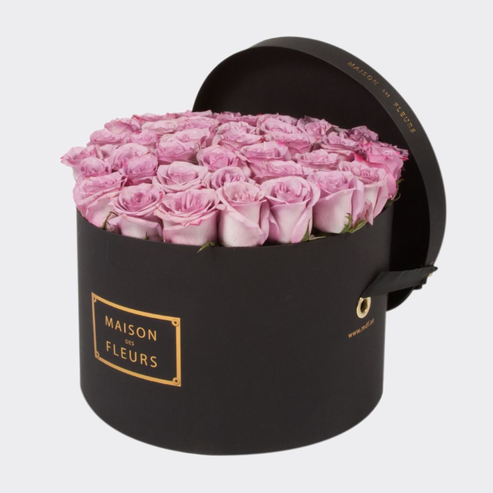Fresh Purple Roses in a Large Black Round Box
