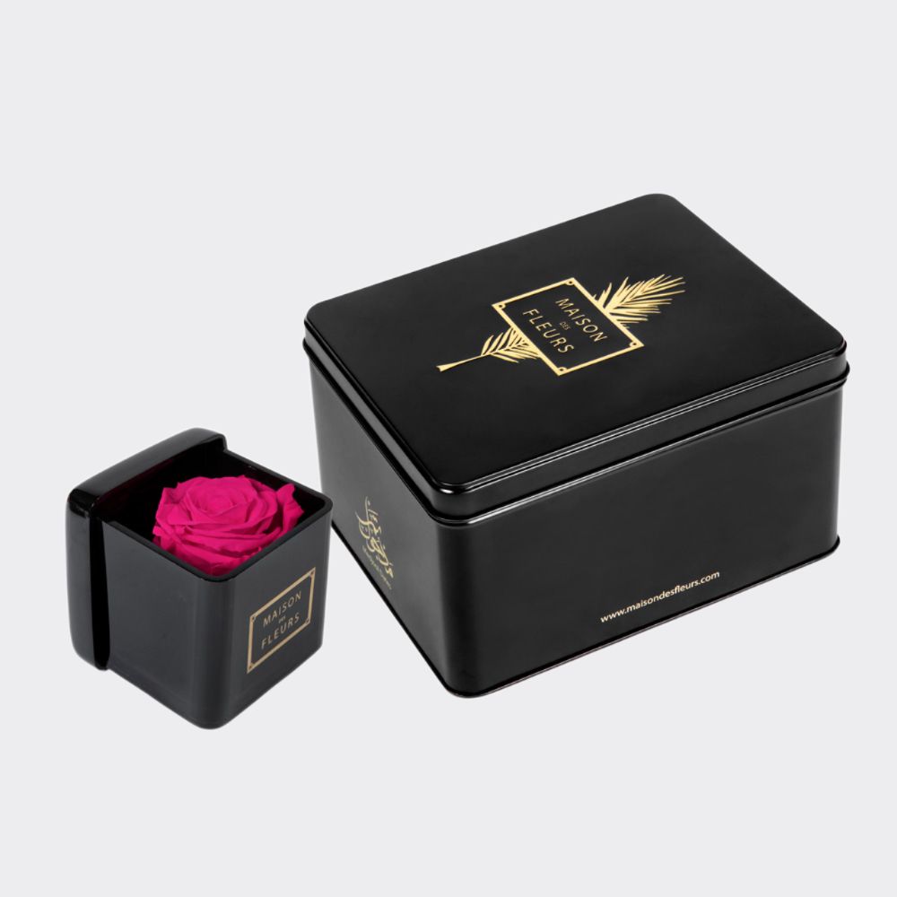 Gift set of large Medjool dates box with a single fuchsia long life rose in an 8 cm black acrylic box.