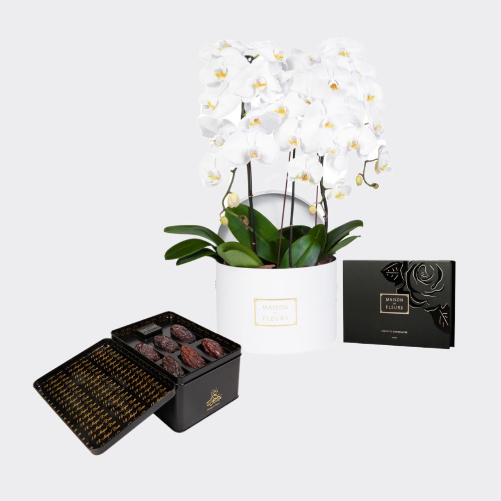 Gift set of 3 white orchid stems in a white 30 cm round box, with premium Medjool dates and an assortment of chocolates.