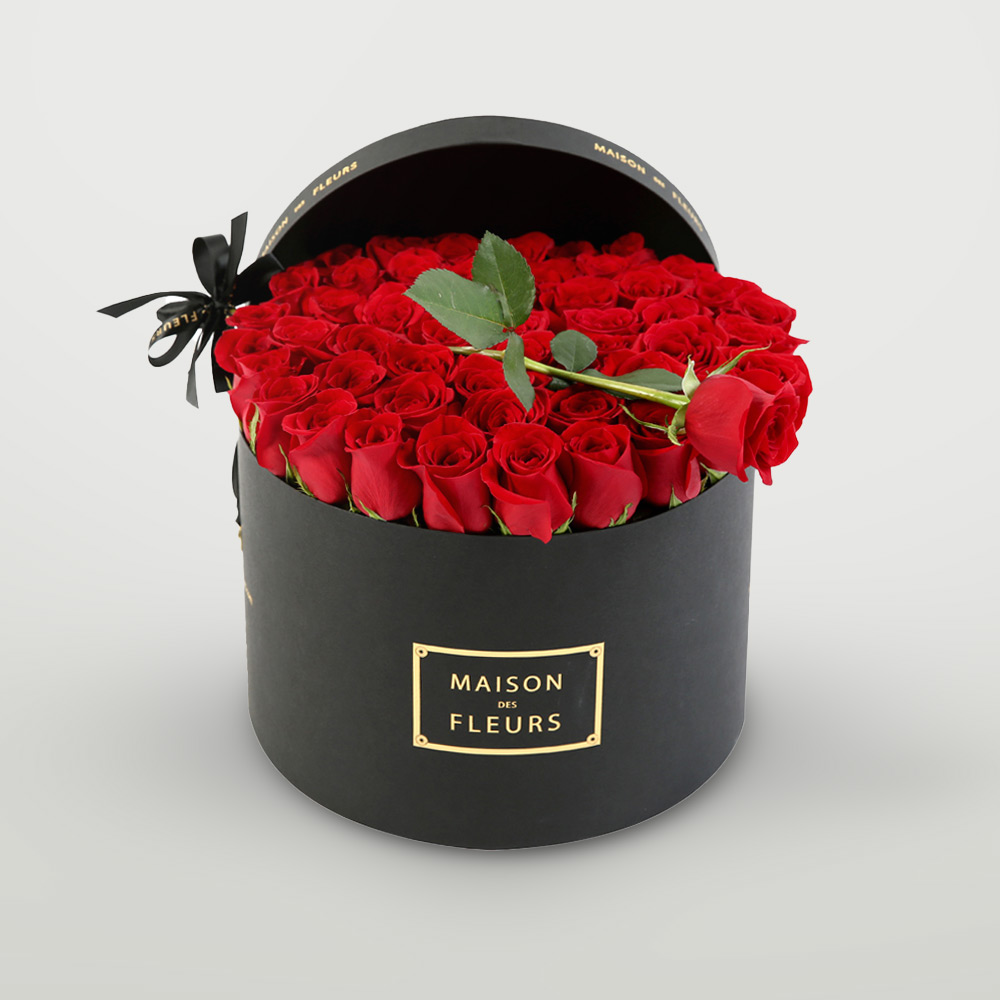 Fresh Roses in a Black Box